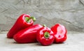 Ripe red peppers on concrete background Royalty Free Stock Photo