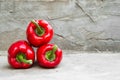 Ripe red peppers on concrete background Royalty Free Stock Photo