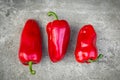 Ripe red peppers on grey background Royalty Free Stock Photo