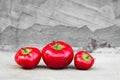 Ripe red peppers on concrete background Royalty Free Stock Photo
