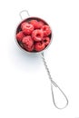 Ripe red raspberries in strainer Royalty Free Stock Photo