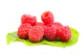 Ripe red raspberry on green laeves