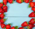 Ripe red strawberries on a blue wooden background Royalty Free Stock Photo