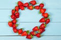 Ripe red strawberries on a blue wooden background Royalty Free Stock Photo