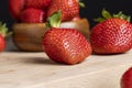 Ripe red strawberries lying on a wooden tray Royalty Free Stock Photo