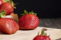 Ripe red strawberries lying on a wooden tray Royalty Free Stock Photo