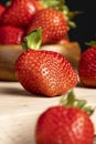 Ripe red strawberries lying on a wooden tray Royalty Free Stock Photo