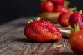 Ripe red strawberries lying on a wooden tray Royalty Free Stock Photo