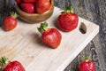 Ripe red strawberries lying on a wooden tray Royalty Free Stock Photo