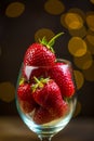 Ripe red strawberries in warm romantic colors with blur background.