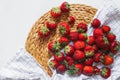 Ripe red strawberry on checkered fabric, summer berry still-life, picnic. Strawberry background