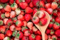 ripe red strawberry with wooden spoon background Royalty Free Stock Photo