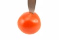 Ripe red tomato cut with a knife Royalty Free Stock Photo