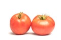 Red tomato lies on a white background