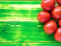 ripe red tomatoes on bright green wooden background table, Royalty Free Stock Photo