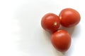 Ripe red tomatoes on a white background one and several Royalty Free Stock Photo