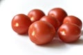 Ripe red tomatoes on a white background one and several Royalty Free Stock Photo