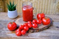 Ripe red tomatoes on wooden table, fresh tomato juice in glass, vegetarian food, Healthy Eating and Vegetarianism, Healthy Royalty Free Stock Photo