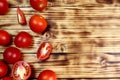 Ripe red tomatoes on a wooden table