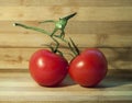 Ripe red Tomatos on the wooden desk Royalty Free Stock Photo