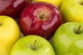 Ripe red and yellow apples on white background