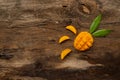 Ripe sliced mango and leaf