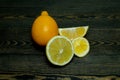 Ripe source lemons on a wooden background