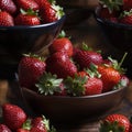 Ripe strawberries in bowls with intense lighting and strong contrast (tiled