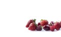 Ripe strawberries, red berries and raspberries on white background. Background of mix fruits with copy space for text. Mix berries Royalty Free Stock Photo