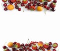 Ripe strawberries, redcurrants, apricots and cherries on white