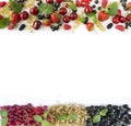 Ripe strawberries, redcurrants, blackcurrants, mulberries, raspberries and cherries on white background.