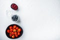 Ripe  strawberry, cranberry and blueberry in bowl, top view, on white background Royalty Free Stock Photo