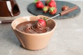 Ripe strawberry dipped into chocolate fondue Royalty Free Stock Photo