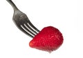 Ripe strawberry on a fork