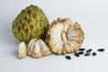 Ripe sugar apple ( srikaya ) ready to eat and black seed granules isolated on white background