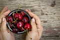 Ripe sweet cherry, hands of woman, organic dessert copy space, top view