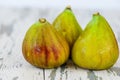 Ripe sweet figs with green leaves. Healthy fig fruit