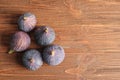 Ripe sweet figs on wooden background, top view