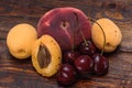 Ripe and sweet fruits on dark wooden background