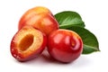 Ripe sweet red plums with leaves and a half of red plum fruit, isolated on white background. Close-up Royalty Free Stock Photo