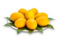 Ripe sweet yellow marian plum decorated in white ceramic dish isolated on white background Royalty Free Stock Photo