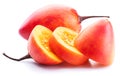 Ripe tamarillo fruits with tamarillo slices isolated on a white background Royalty Free Stock Photo