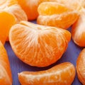 Ripe tangerine fruit on blue board