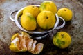 Ripe tangerines in bowl on the old background Royalty Free Stock Photo