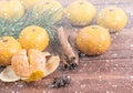 Ripe Tangerines With Fir Branch In Snow Close Up