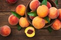 Ripe and tasty and juicy peaches lie on a plate on a wooden table. Large peaches on rustic wooden background, selective focus Royalty Free Stock Photo