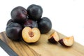 Ripe tasty plums on the wooden board Royalty Free Stock Photo