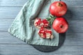 Ripe tasty pomegranates on table