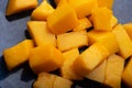 Ripe and tasty vibrant orange egyption Mango cubes. macro shot Royalty Free Stock Photo