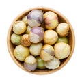 Ripe tomatillo Mexican husk tomato, Physalis philadelphica, Vegetable physalis in wooden bowl isolated on white. Top view